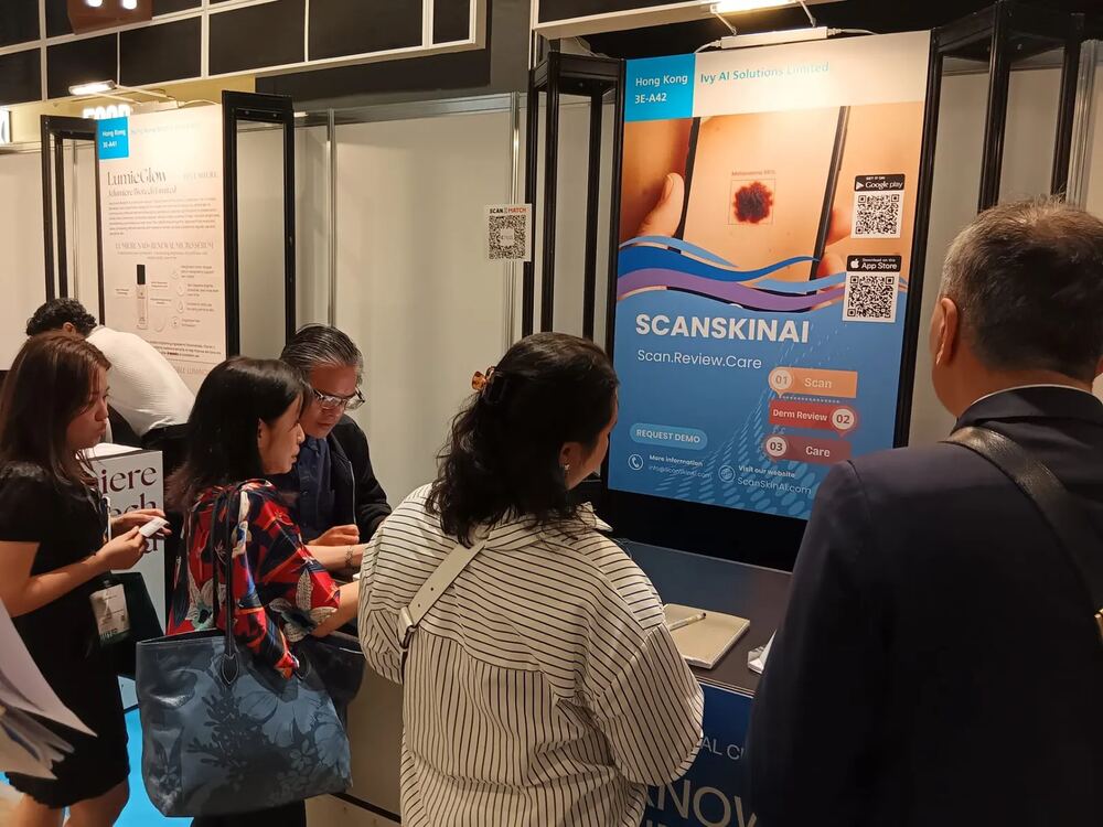 ScanSkinAI booth 3E-A42 at the HKTDC International Medical and Healthcare Fair 2026 in Hong Kong, with partners reviewing the AI skin cancer screening API.